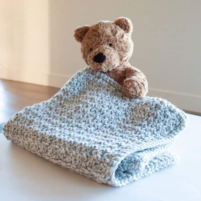 A beautifully handcrafted soft crochet baby blanket, made with delicate and cozy yarn. The intricate crochet pattern adds a charming texture, perfect for keeping little ones warm and comfortable.