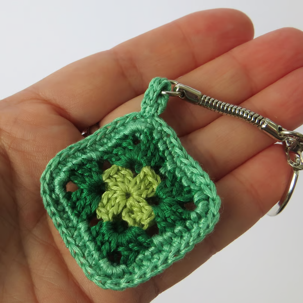 Colorful handmade crochet granny square keychains with a vintage-inspired design, perfect for retro lovers and craft enthusiasts.