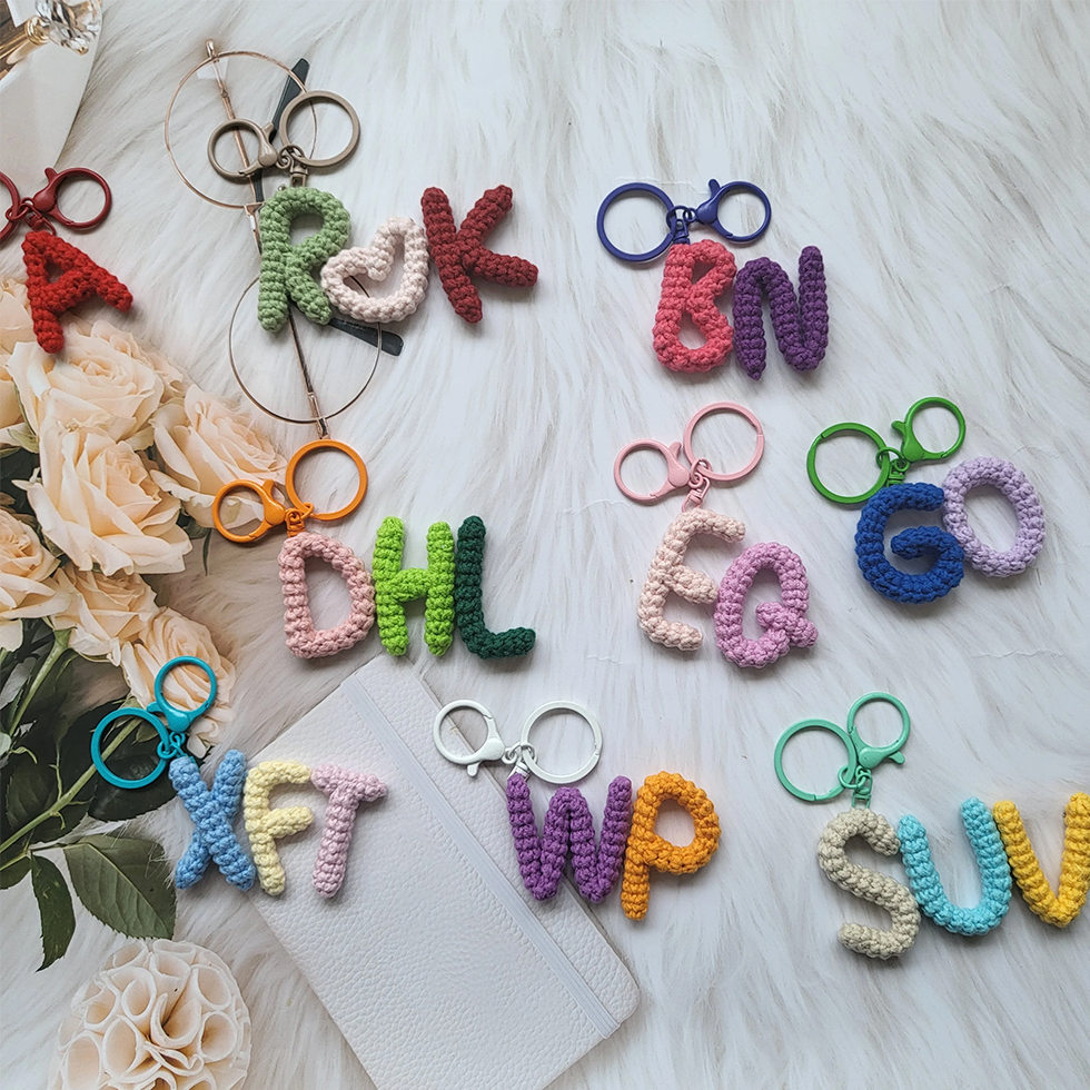 Handmade personalized crochet name keychains with custom initials or name tags, perfect for a unique and thoughtful gift.